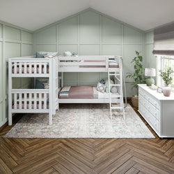 White bunk bed with ladder in a stylish light green room featuring wooden flooring and modern decor.
