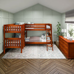 Wooden bunk bed in a cozy bedroom with herringbone flooring and mint green walls.