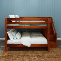 Wooden bunk bed with stairs in a cozy bedroom setting.