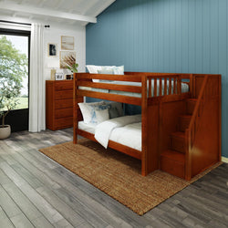 Wooden bunk bed with stairs in a modern bedroom featuring a blue accent wall, natural light, and hardwood floors.