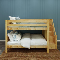 Wooden bunk bed with stairs in modern bedroom setting.