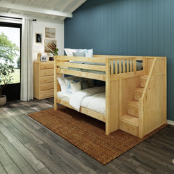 Space-saving wooden bunk bed with staircase in a modern kids' room, featuring blue accent wall and natural light.