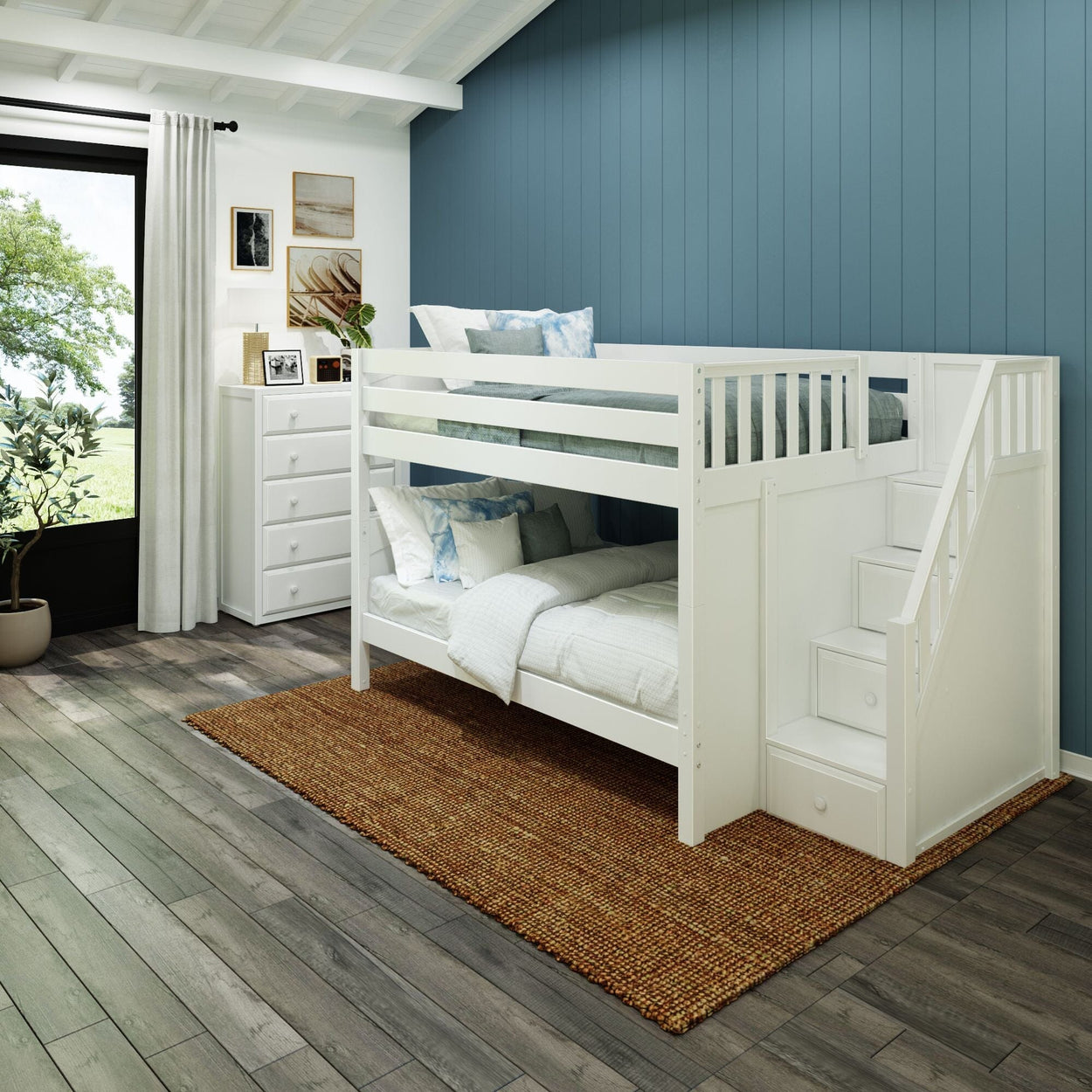 White wooden bunk bed in a modern kids room with blue accent wall and decorative elements.