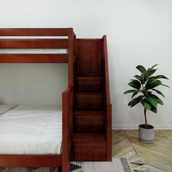 Bunk bed with storage stairs and indoor plant in modern bedroom.