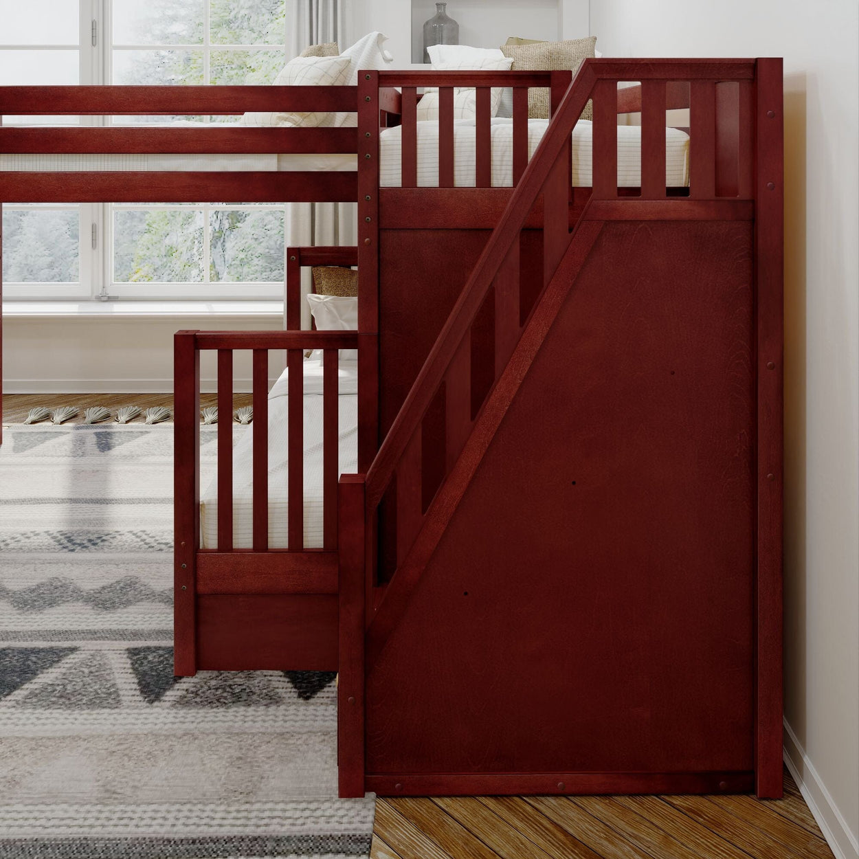 Red wooden bunk bed with a built-in ladder in a bright bedroom setting.