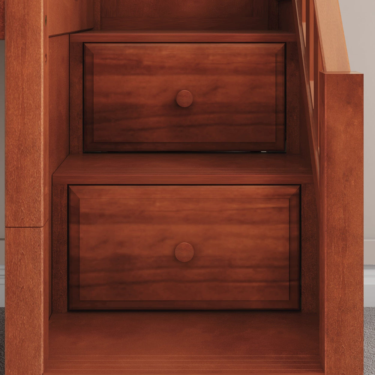 Under-stair wooden storage drawers with mahogany finish.
