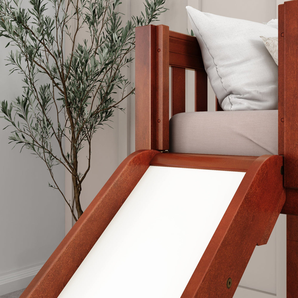 Wooden loft bed with slide and white bedding in a modern bedroom setting.