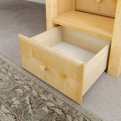 Open wooden drawer on a carpeted floor showcasing home furniture design.