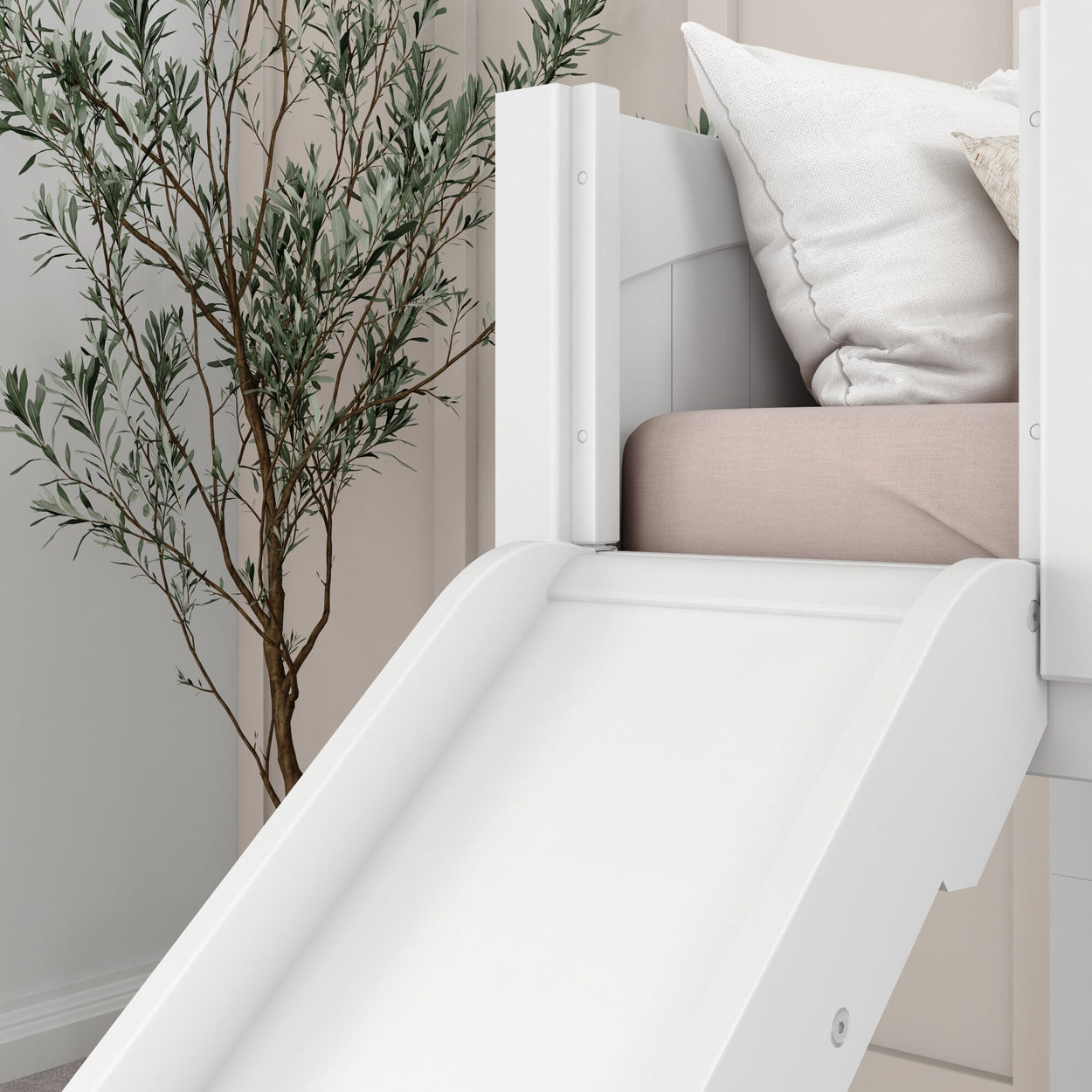 White children's bed with integrated slide and decorative plant, modern kids' room furniture.