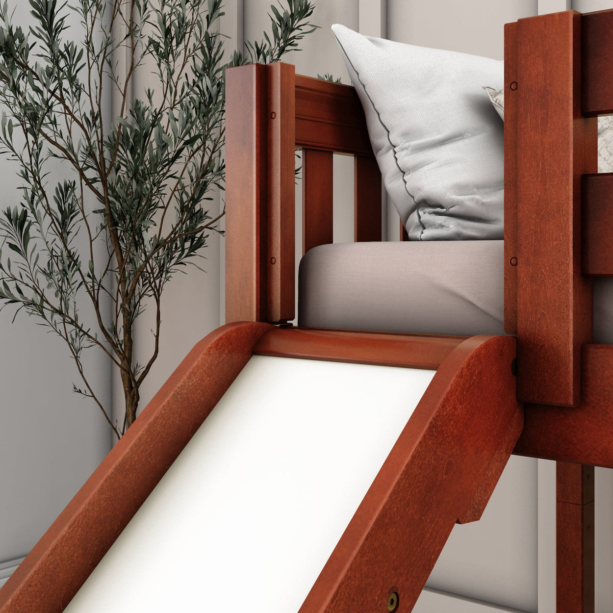 Wooden bunk bed with slide and pillows in a modern bedroom setting.
