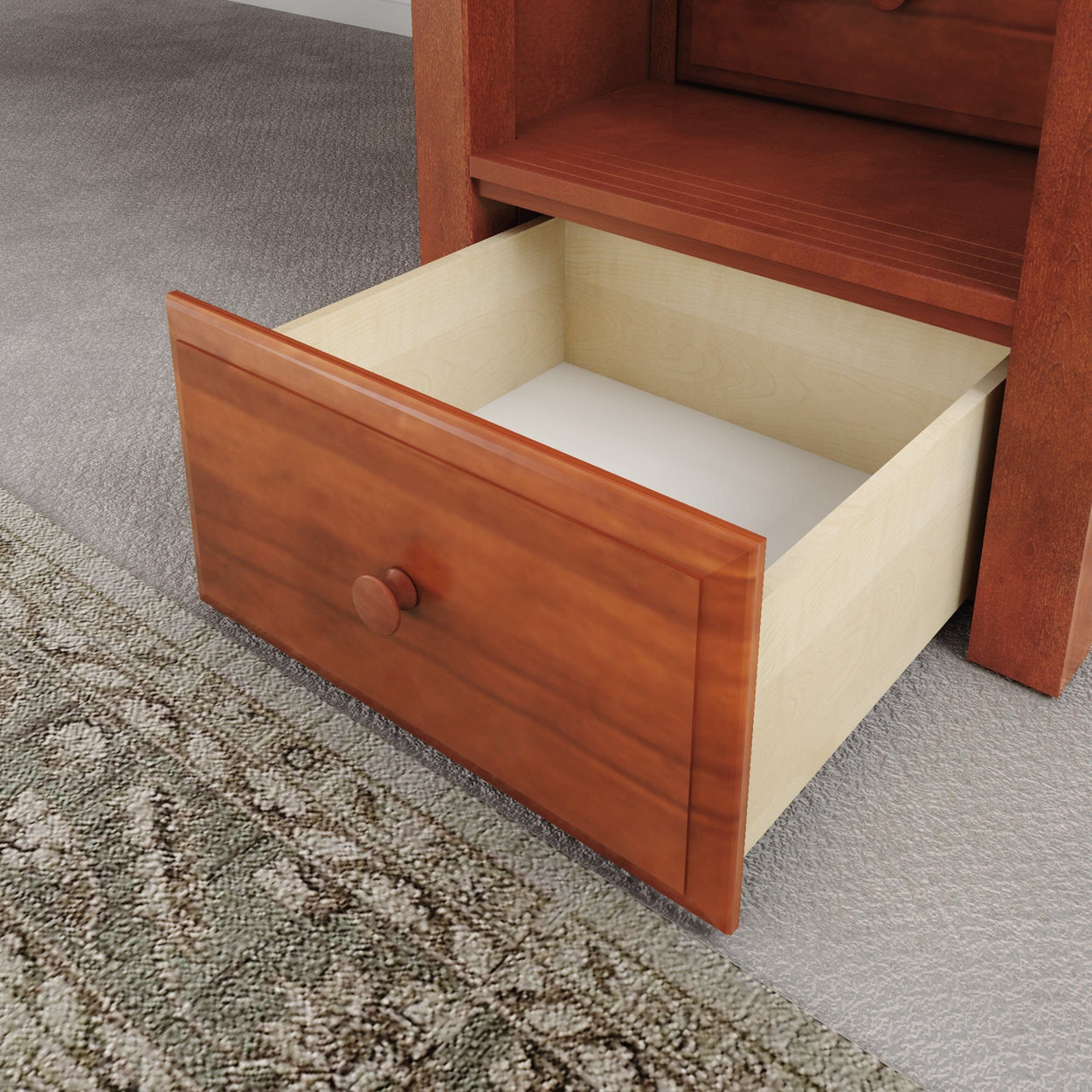 Open wooden drawer on carpeted floor, showcasing home storage solution.