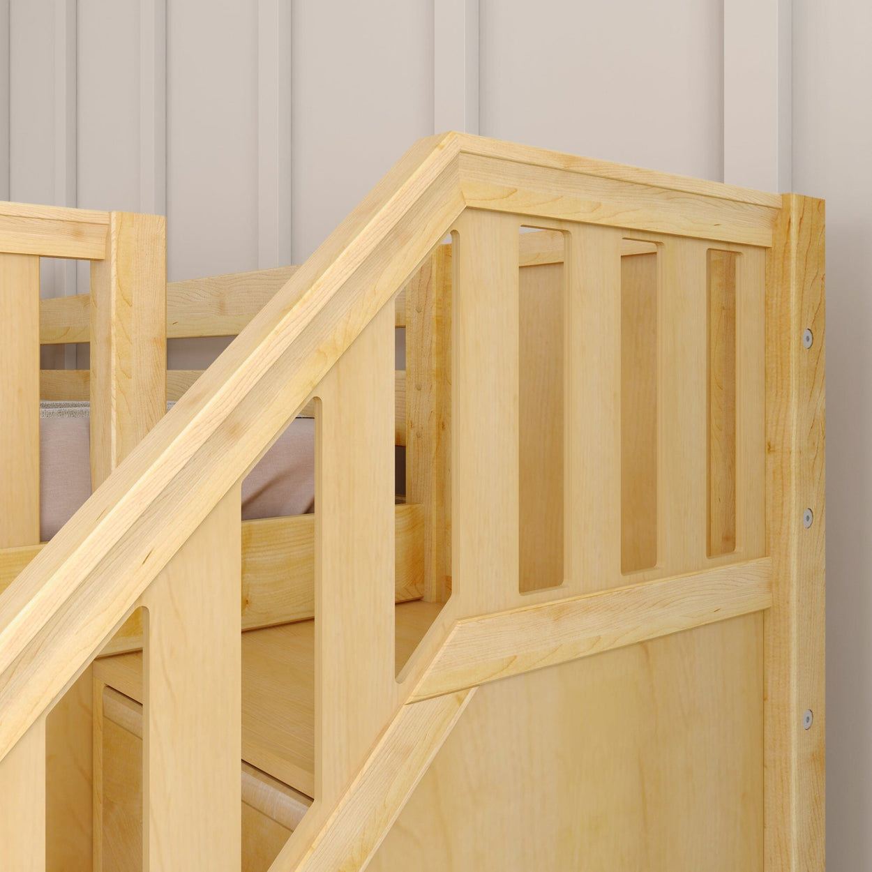 Close-up of the corner of a wooden bunk bed with light natural finish in a cozy bedroom setting.