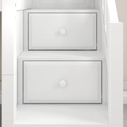 White wooden staircase with built-in storage drawers for space-saving design.
