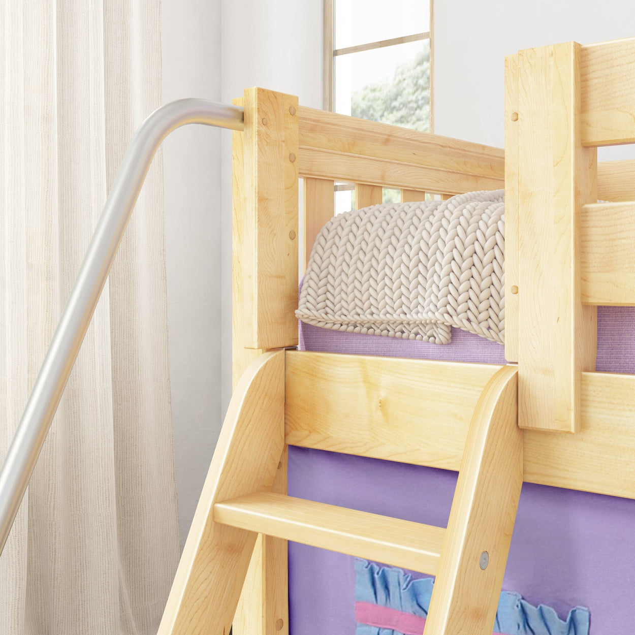 Wooden bunk bed with ladder and cozy knitted blanket in a bright, modern bedroom.