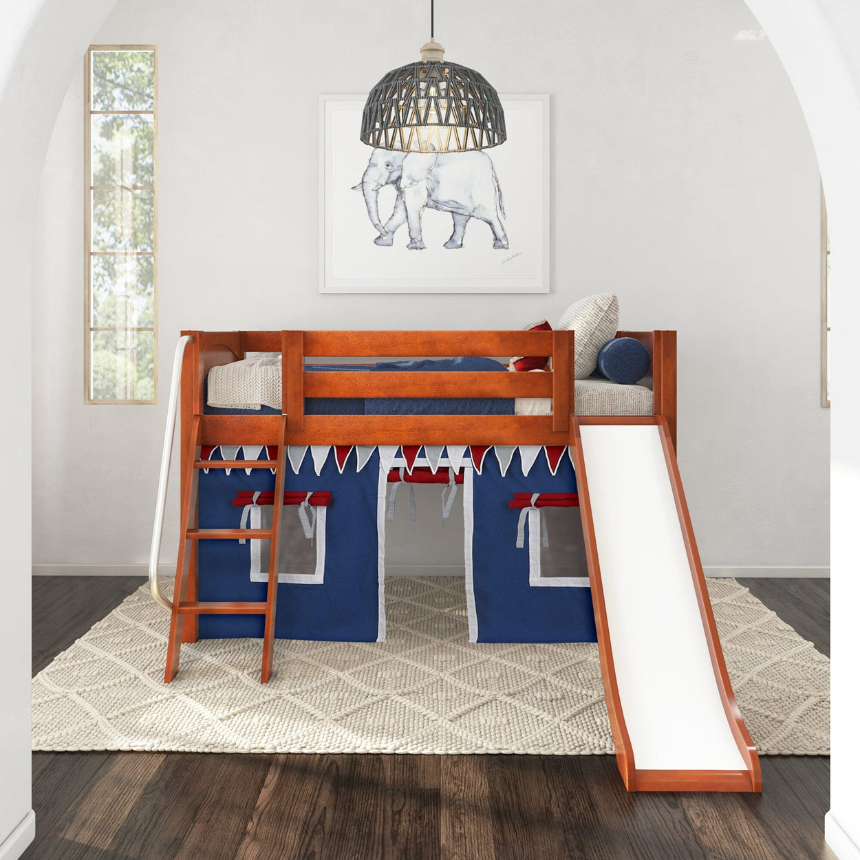 Loft bed with slide and storage tent in modern kids' bedroom with playful elephant artwork.