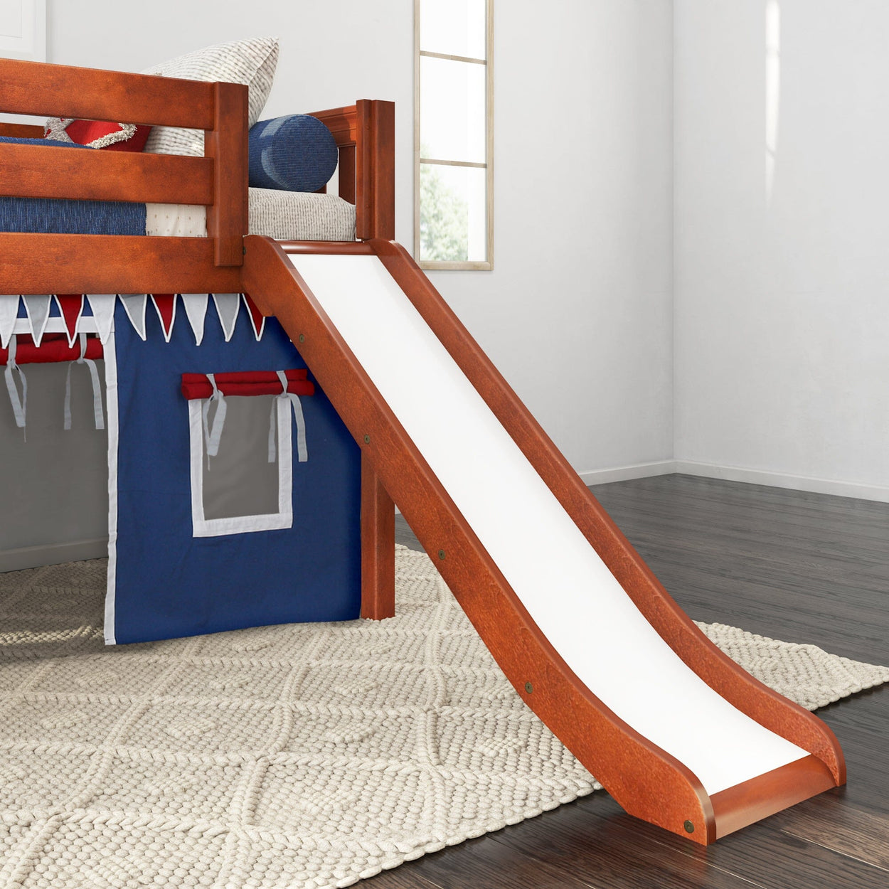 Wooden loft bed with slide and blue play tent for kids' bedroom.