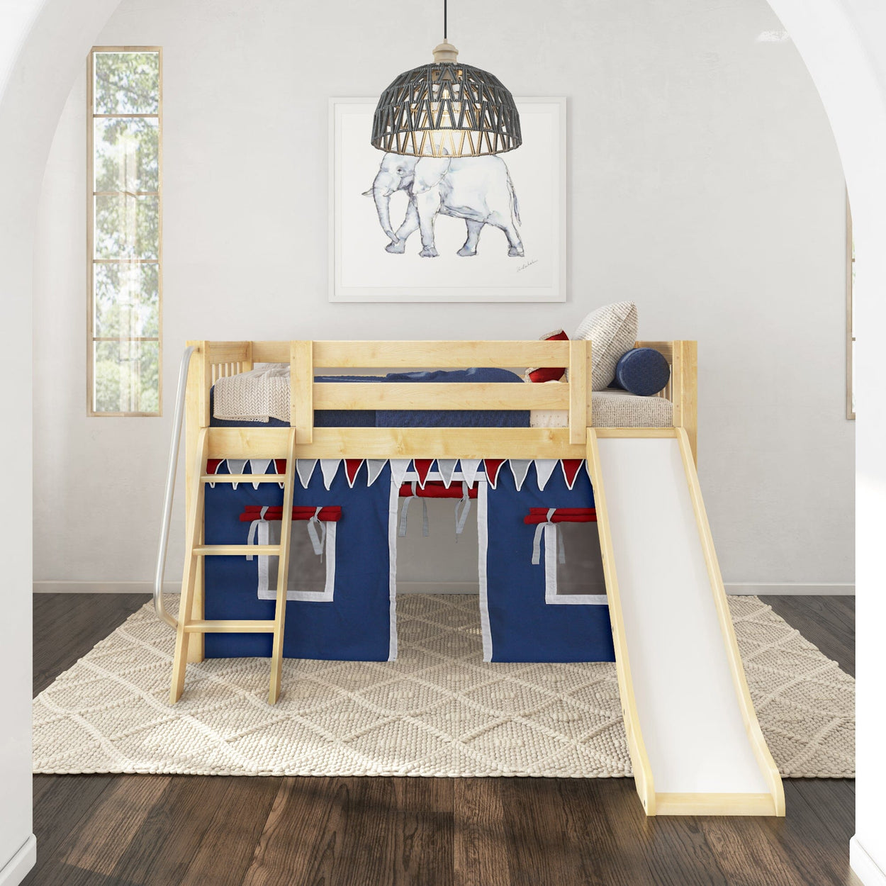 Loft bed with slide and play curtains in a children's room decorated with elephant artwork.