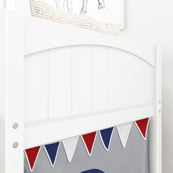 White bunk bed with festive red, white, and blue bunting in a modern children's room.