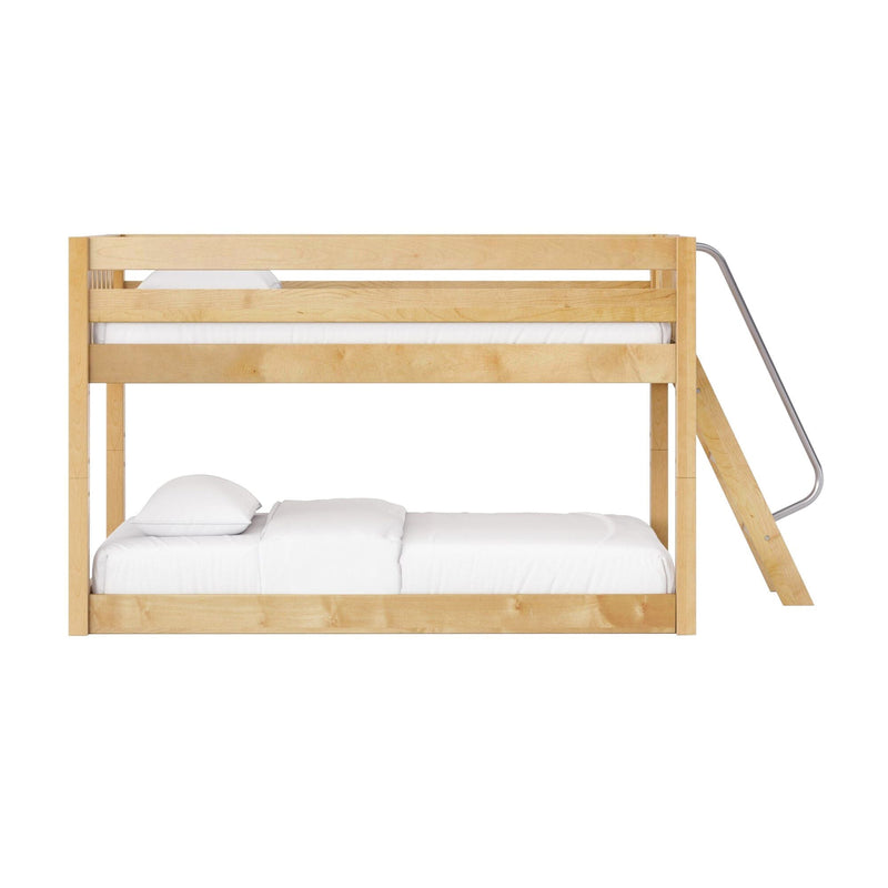 Solid wood twin-over-full bunk bed in natural maple finish with safety rails and angled metal ladder, staged with white bedding for a modern, space-saving bedroom