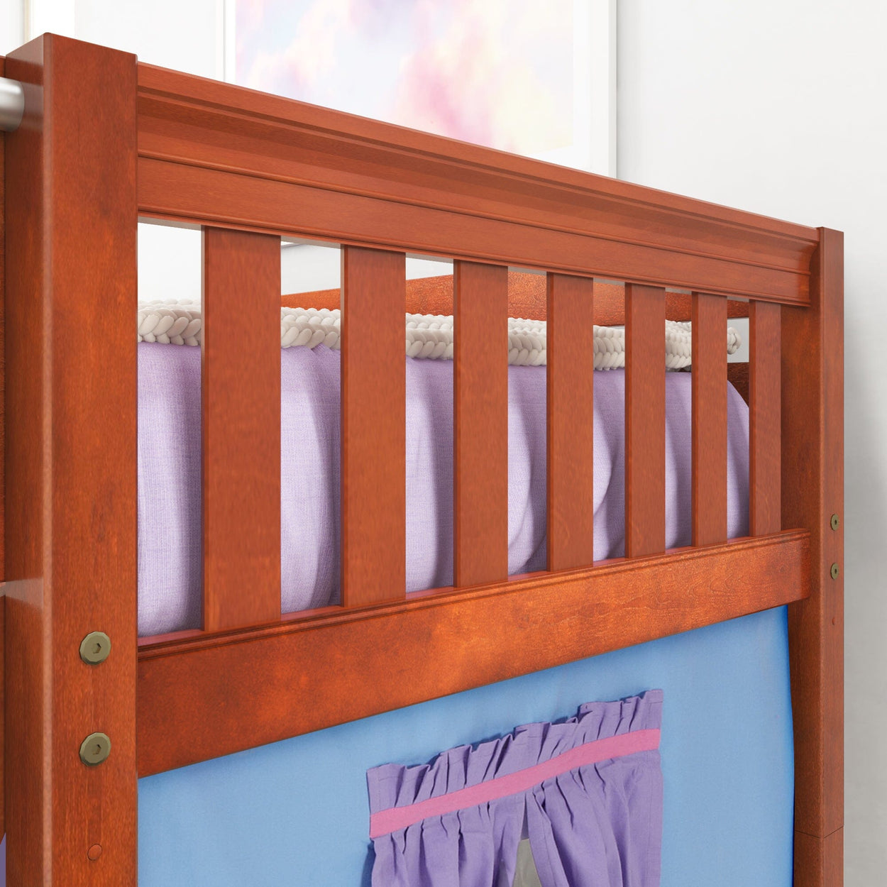Wooden bunk bed frame with colorful bedding and curtain accents in a child's bedroom.
