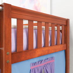 Wooden bunk bed frame with colorful bedding and curtain accents in a child's bedroom.
