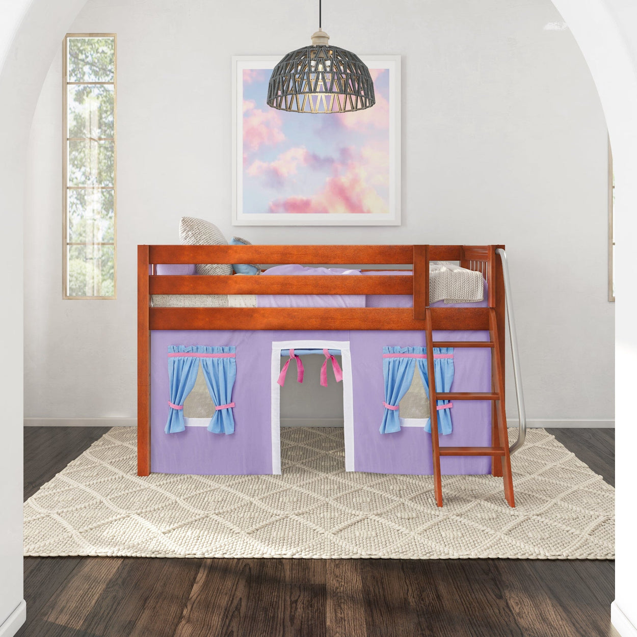 Loft bed with pink and blue playhouse curtains, wooden ladder, in a bright children's room with cloud painting.