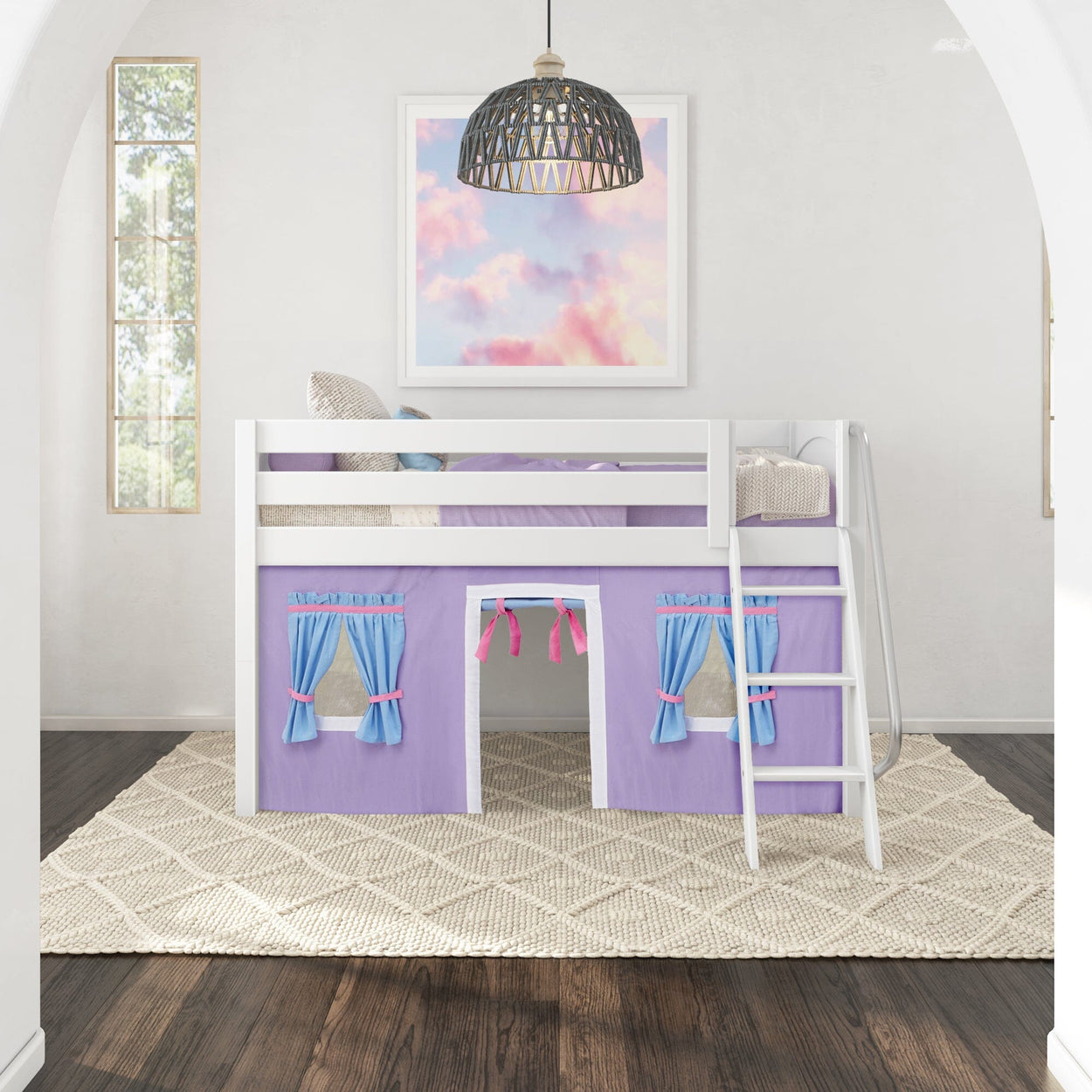 Kids loft bed with ladder and playhouse curtain in a bright, airy bedroom.