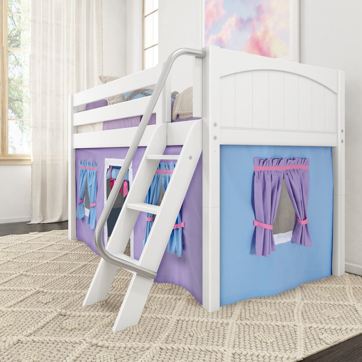 White wooden loft bed with colorful playhouse curtains and built-in ladder in a bright children's room.