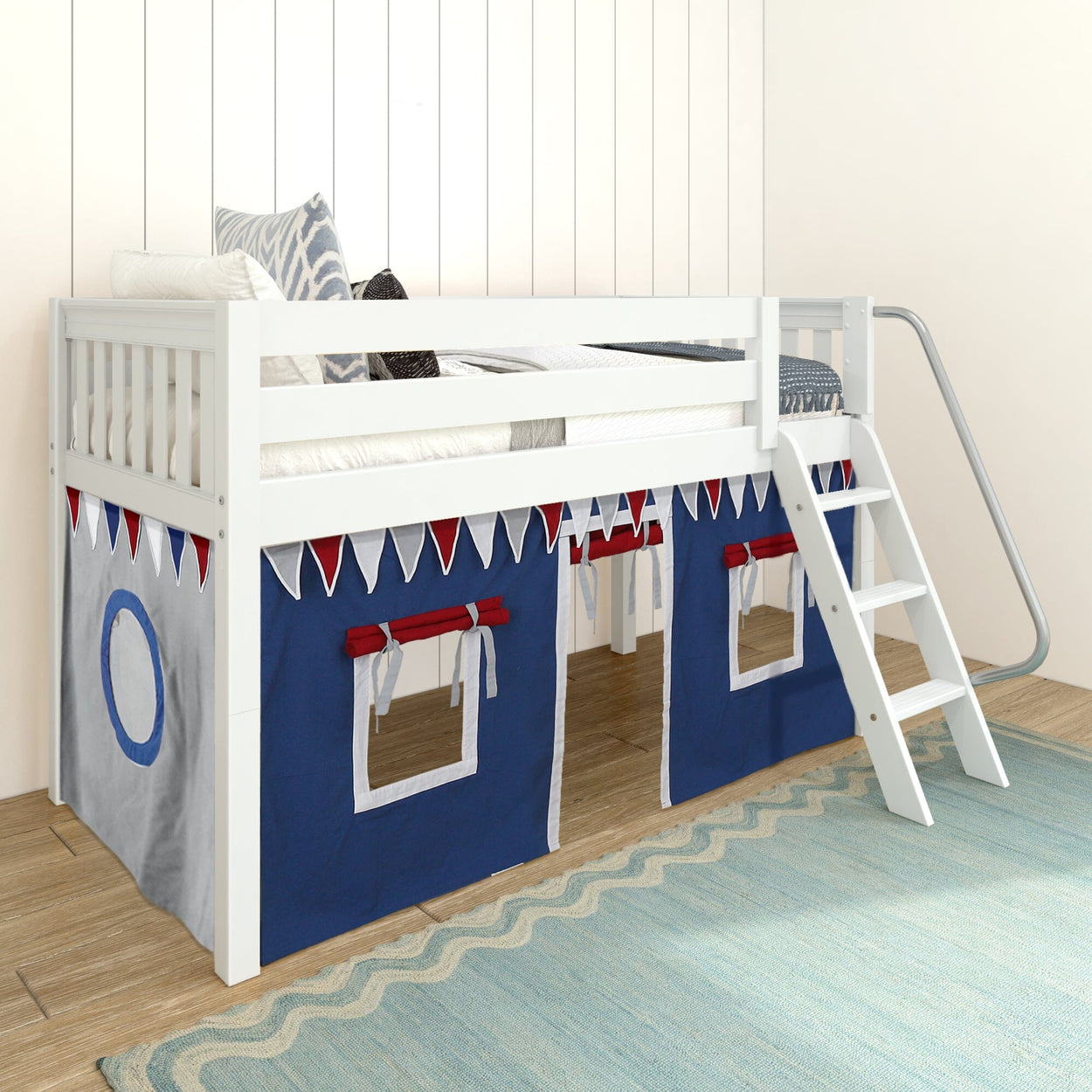 White wooden loft bed with ladder and blue-red playhouse curtains, ideal for children's bedroom decor.