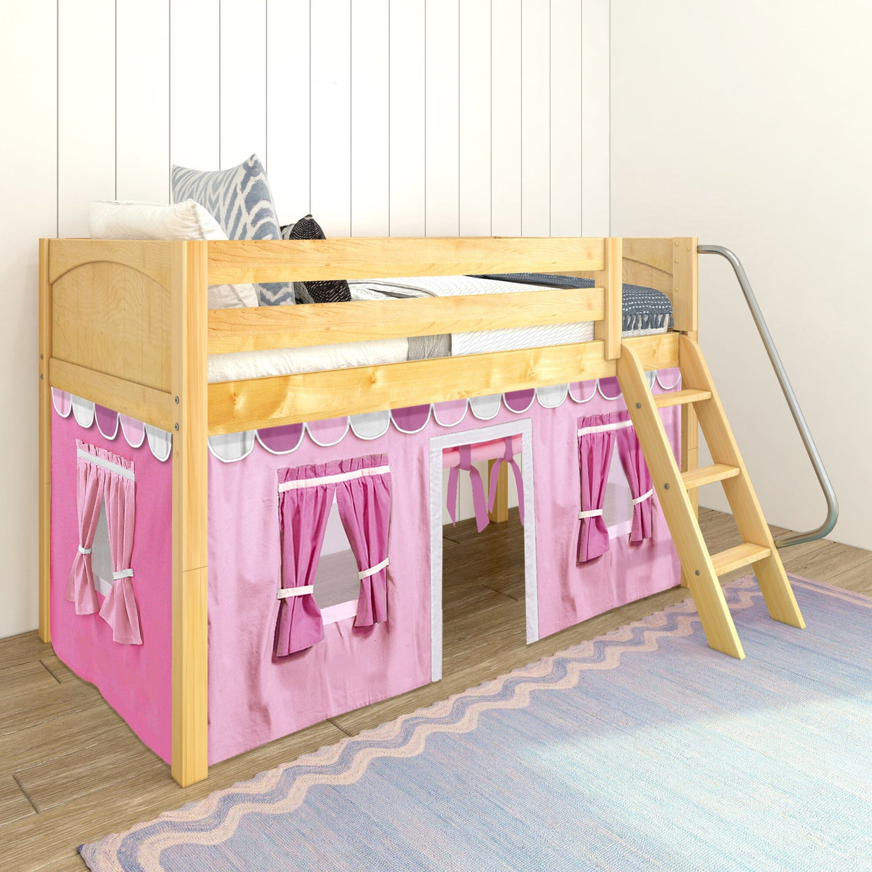 Wooden loft bed with pink playhouse attachment and ladder in a children's bedroom.