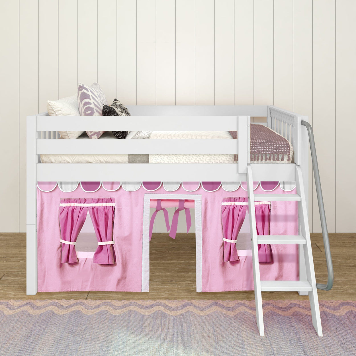 White loft bed with pink curtains and ladder in a child's bedroom.