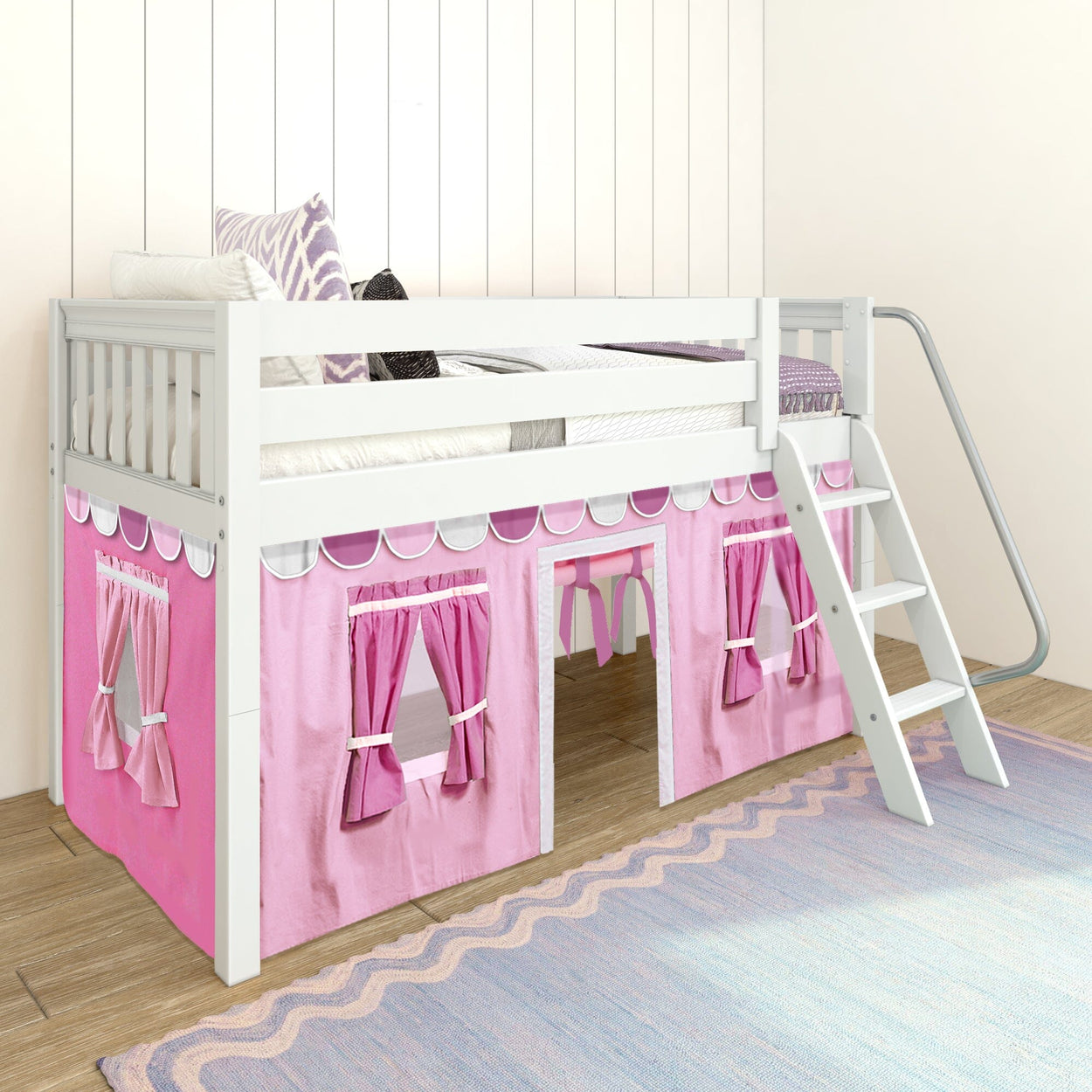 White loft bed with pink playhouse curtain, ladder, and cozy pillows in a kids' bedroom.
