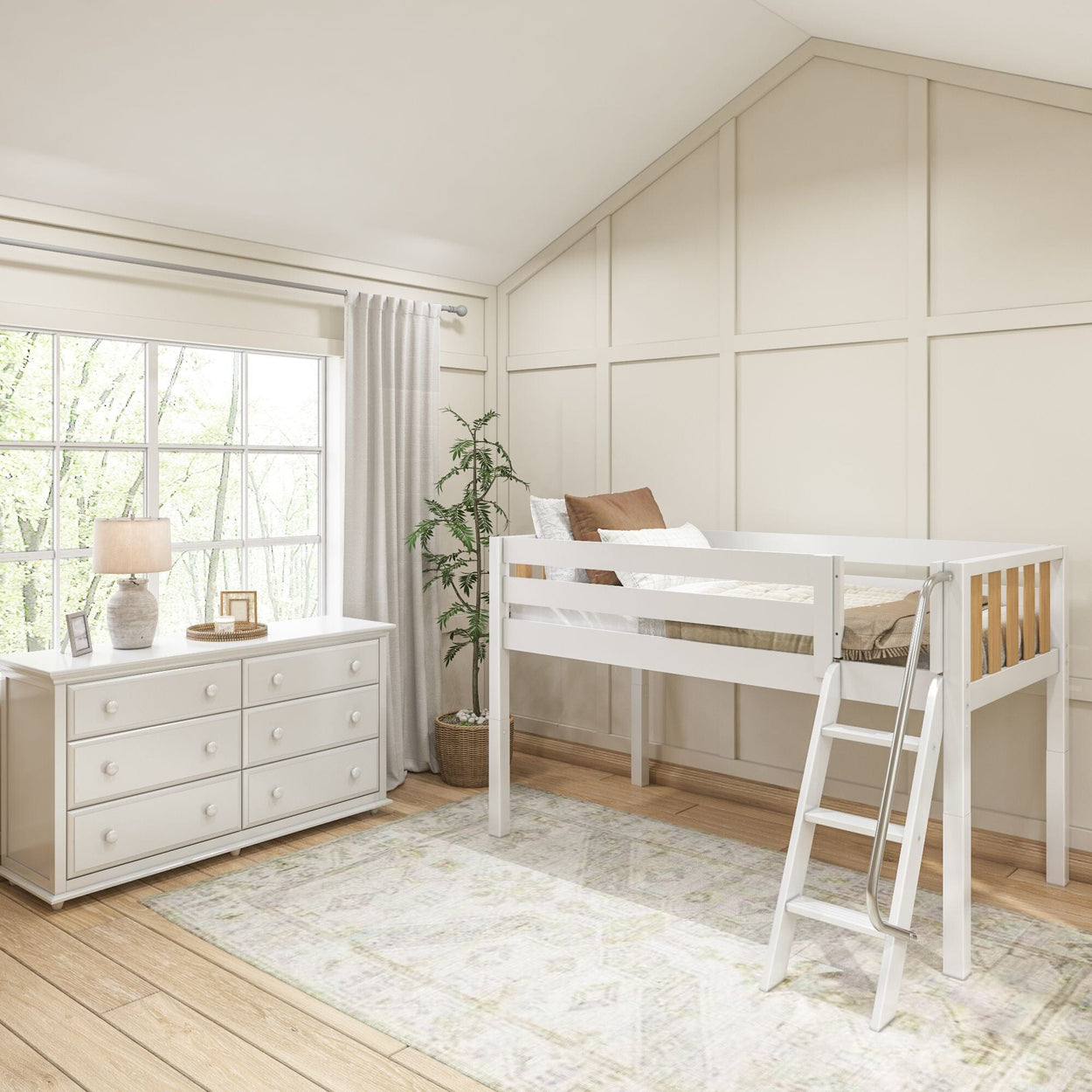 Child's bedroom with a white loft bed and ladder, dresser, and decor, natural light through large window.