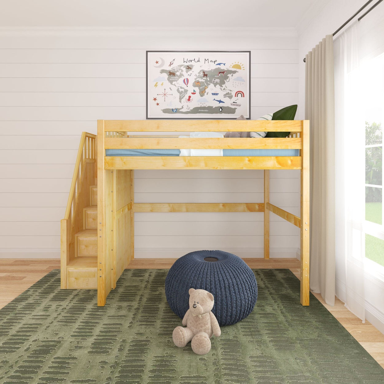 Lofted wooden children's bed with stairs in a bright bedroom, featuring a world map, green rug, blue pouf, and teddy bear.