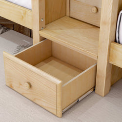 Open wooden drawer beneath bed with light wood finish on carpeted floor.