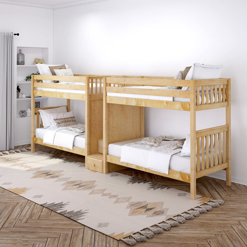 Natural wood twin bunk beds in a bright minimalist kids' bedroom with white bedding and patterned boho rug