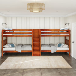 Rustic wooden bunk beds in a cozy, light-filled bedroom with a modern chandelier and neutral decor.