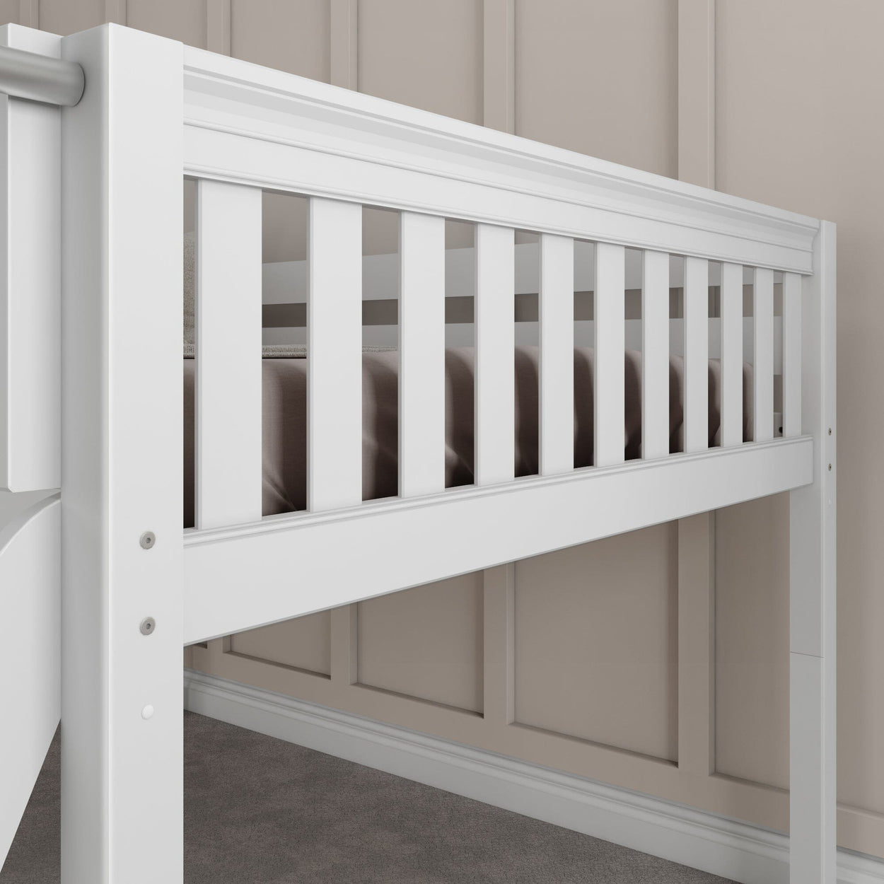 White loft bed frame with slatted guardrail against beige paneled wall in a modern bedroom.