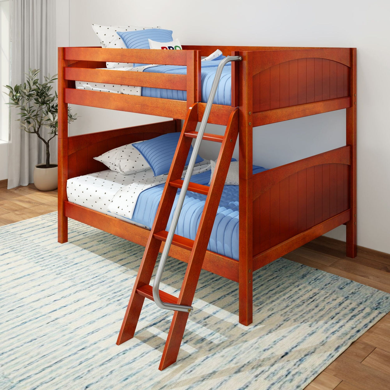 Wooden bunk bed with blue bedding and ladder in a bright children's bedroom.