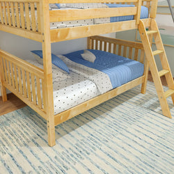 Wooden bunk bed with blue and white bedding in a modern bedroom interior.