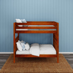 Wooden bunk bed with blue bedding against light blue paneled wall in modern bedroom.