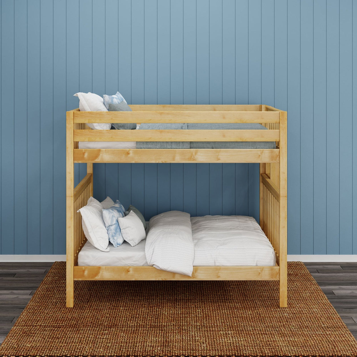 Wooden bunk bed with white bedding in a room with a blue paneled wall.
