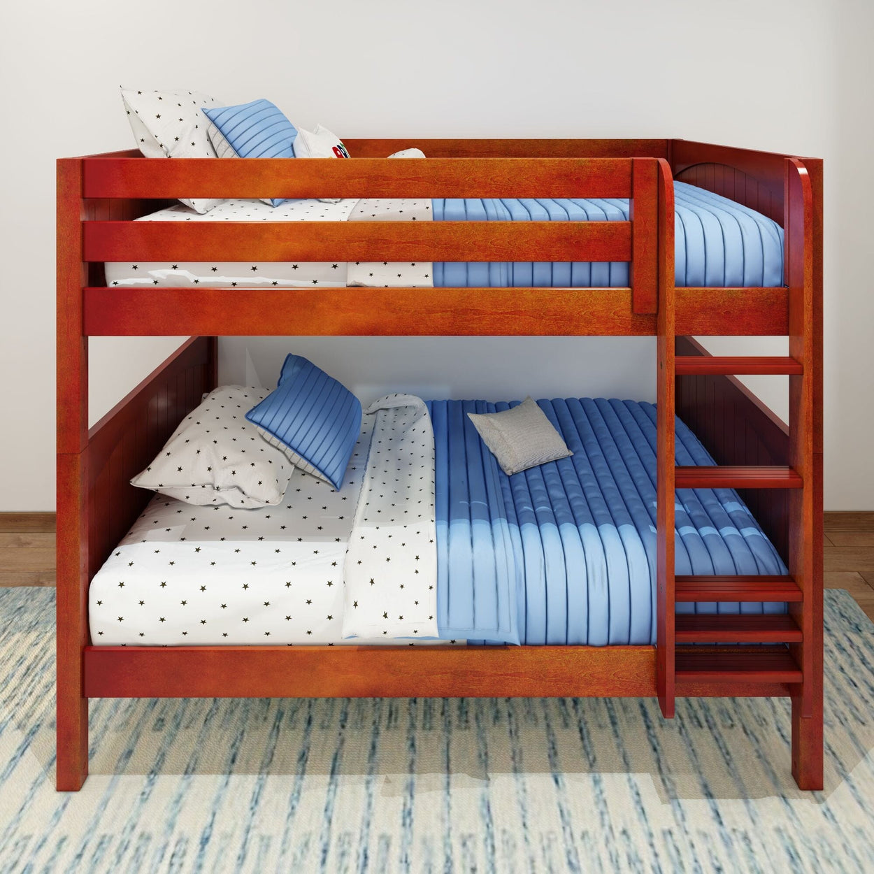 Red wooden bunk bed with blue striped bedding and star-themed pillows.