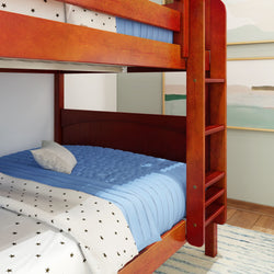Red wooden bunk bed with blue and star-patterned bedding in a cozy bedroom setting.