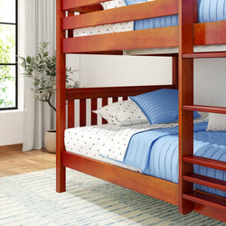 Red wooden bunk bed with blue bedding in a modern bedroom setting.