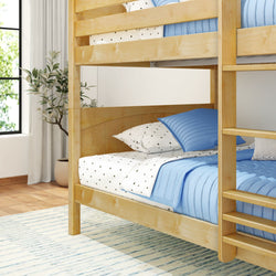 Wooden bunk bed with blue and white star-patterned bedding in a bright, modern bedroom.