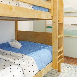 Wooden bunk bed with star-patterned bedding and blue blanket in a cozy children's bedroom.