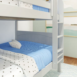 Gray bunk bed with blue bedding in a modern kids' bedroom with star-patterned sheets.