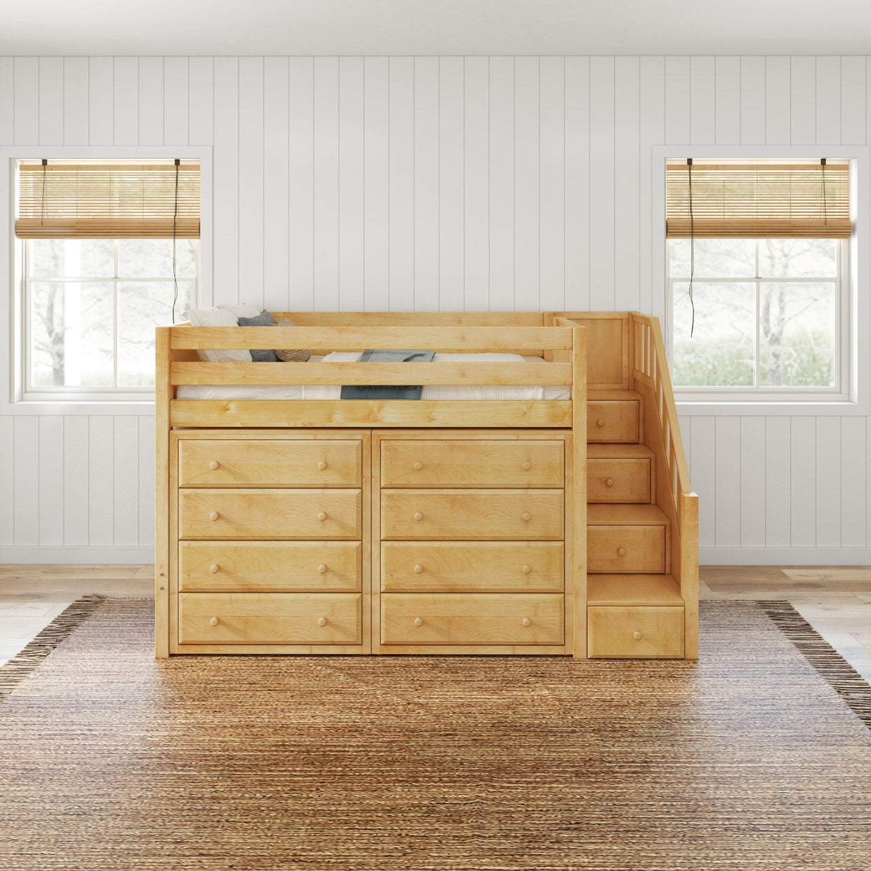 Wooden loft bed with built-in storage drawers and stairway in a modern, bright room with white shiplap walls.