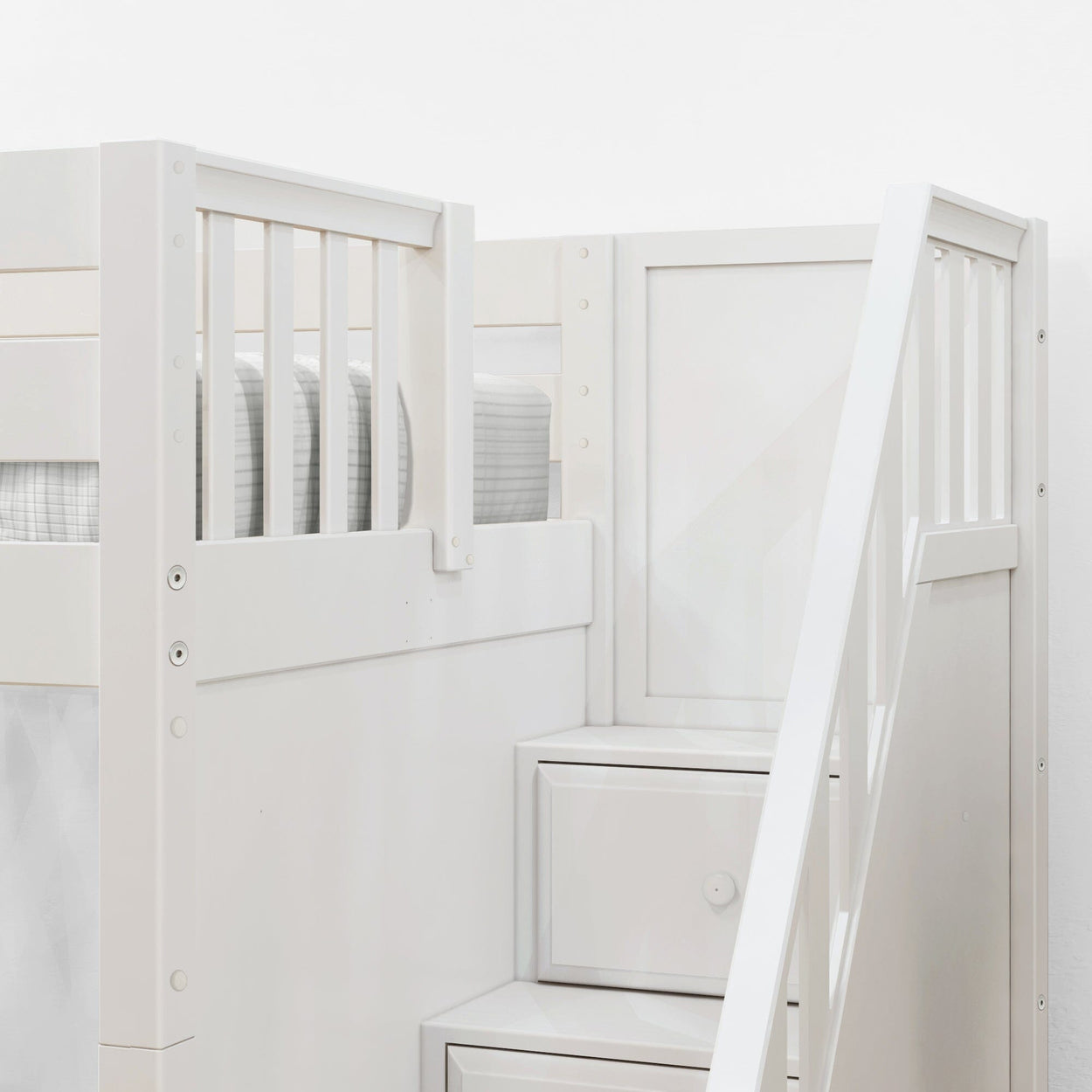 White loft bed with built-in staircase and storage drawers for kids' bedroom.